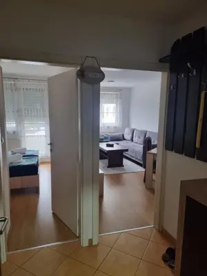 a living room with a couch and a table at CityLux Doboj in Doboj