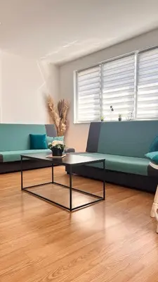 a living room with a couch and a coffee table at MG in Žepče