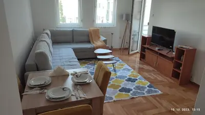 a living room with a couch and a table at Apartmani Elix in Banja Luka