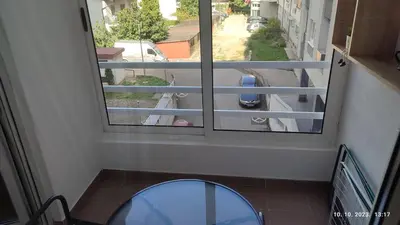a view of a street from a window with a mirror at Apartmani Elix in Banja Luka