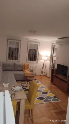 a living room with a couch and a table at Apartmani Elix in Banja Luka