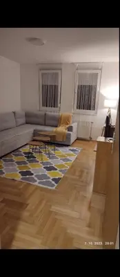a living room with a couch and a table at Apartmani Elix in Banja Luka