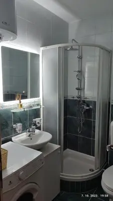 a bathroom with a shower and a sink and a toilet at Apartmani Elix in Banja Luka