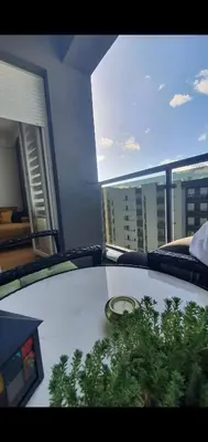 a table in a room with a view of a building at Apartman Ada Banja Luka in Rebrovac