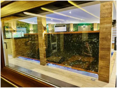a room with a large window with a fish tank at Villa Almedina Spa in Vlasic