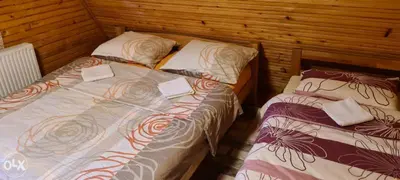 two beds sitting next to each other in a room at Villa Almedina Spa in Vlasic