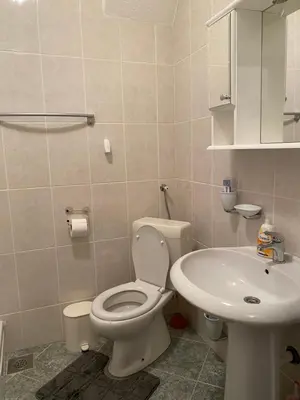 a bathroom with a toilet and a sink at Apartman MARIJA in Bosanski Šamac