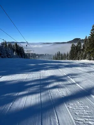 a road covered in snow with a ski lift at Apartman Vlašić Hary in Vlasic
