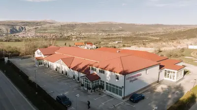 an overhead view of a building with a parking lot at Hotel Bacchus in Livno