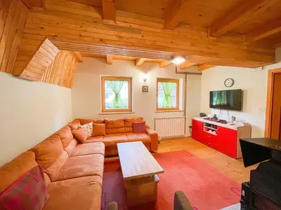 a living room with a couch and a table at Holiday home Bella Vlašić in Šišava