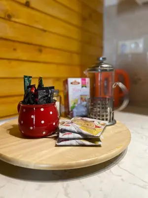 a red cup on a plate next to a blender at Apartmani Snježna Kraljica Vlašić 1 in Vlasic