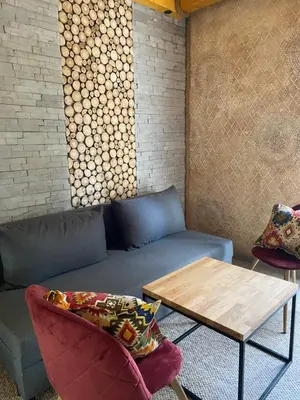 a living room with a couch and a table at Apartmani Snježna Kraljica Vlašić 1 in Vlasic