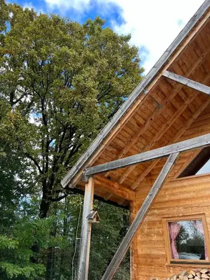 a log cabin with a gambrel roof at Wood Cabin Hillside Retreat in Banja Luka