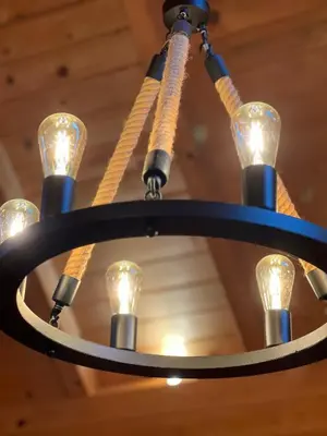 a chandelier hanging from a ceiling at Wood Cabin Hillside Retreat in Banja Luka