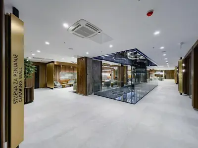 a lobby of a building with a glass wall at Hotel Vema in Visoko