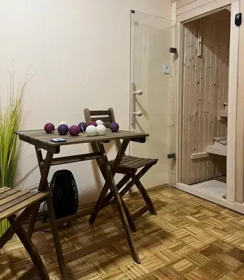 a table with purple balls on it in a room at Stan na dan Kozarska Dubica in Bosanska Dubica