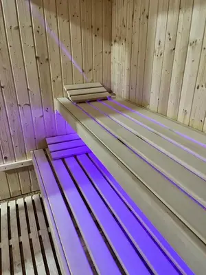 a room with purple sheets on top of a wooden wall at Stan na dan Kozarska Dubica in Bosanska Dubica