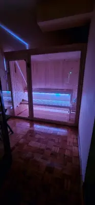an empty room with a window with pink and blue lights at Stan na dan Kozarska Dubica in Bosanska Dubica
