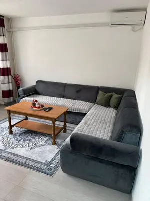 a living room with a couch and a coffee table at Stan na dan Hasanovic in Tuzla