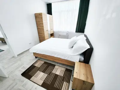 a small bedroom with a bed and a window at Hotel Balon in Velika Kladuša