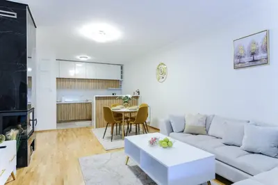 a living room with a couch and a table at Lux Sara Apartments in Visoko