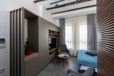 a bedroom with a bed and a desk and a tv at LANTerna Boutique Hotel in Srbac