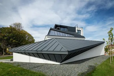 a house with a metal roof on top of it at LANTerna Boutique Hotel in Srbac