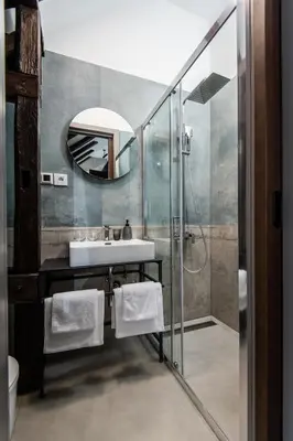 a bathroom with a sink and a mirror at LANTerna Boutique Hotel in Srbac