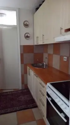a kitchen with a sink and a counter top at Stan u Zenici in Zenica