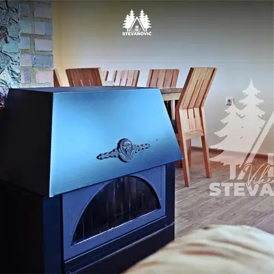 a blue fireplace with a turtle painted on it at Vikendica Stevanovic in Doboj
