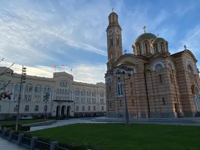 a large building with a clock tower on top of it at Zeus apartman in Banja Luka