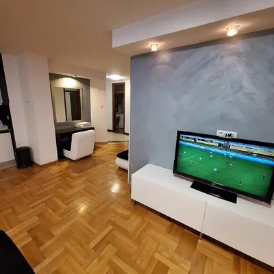 a living room with a large flat screen tv at Luks apartment in Banja Luka