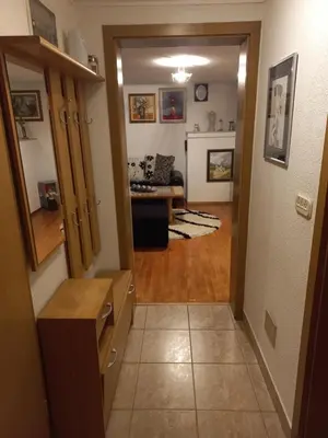 a hallway leading into a living room with a living room at Apartman Bony M in Kiseljak