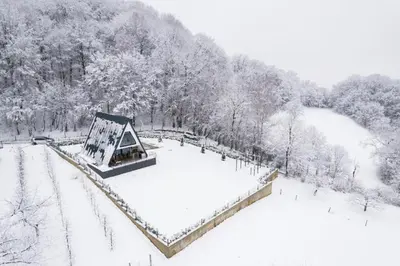 a park covered in snow with a tent at Vila Hasandić in Visoko