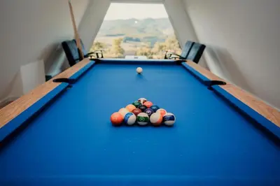 a pool table with balls on top of it at Vila Hasandić in Visoko