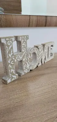 a wooden drawer with the word love on it at SunShine Apartman CityBlock in Banja Luka
