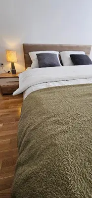 a large bed in a bedroom with a bed sidx sidx sidx at SunShine Apartman CityBlock in Banja Luka