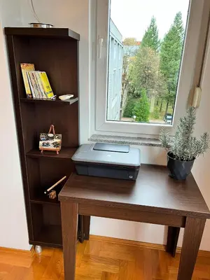 a laptop sitting on a table next to a window at Apartman Sudnica Banja Luka in Banja Luka