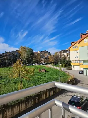a view from a balcony of a field with houses at Apartman Lollita in Banja Luka