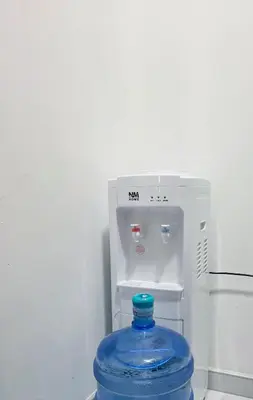 a blue water bottle in front of a refrigerator at Riverstone Retreat Studio in Jajce