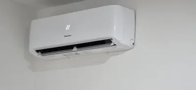 a white toaster hanging on a white wall at Riverstone Retreat Studio in Jajce