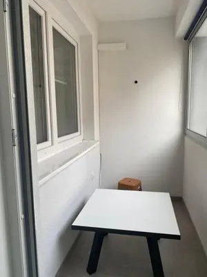 a white table in a room with a window at ,,Azra,, Apartment in Bihać