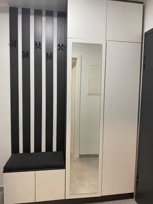a dressing room with a mirror and a white cabinet at ,,Azra,, Apartment in Bihać