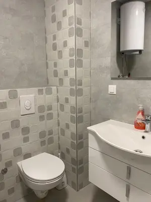 a bathroom with a toilet and a sink at ,,Azra,, Apartment in Bihać