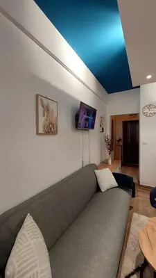 a living room with a couch and a flat screen tv at Apartman Jereza Prijedor in Prijedor