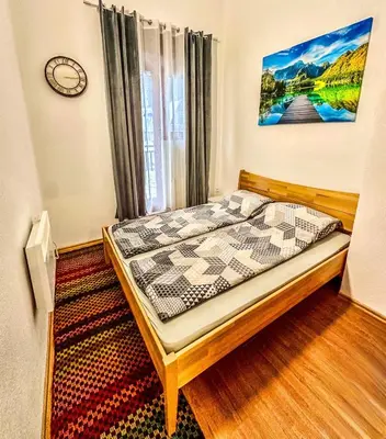 a bedroom with a bed in a room at Apartman RAJAN Vlašić in Vlasic