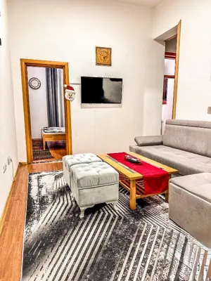 a living room with a couch and a table at Apartman RAJAN Vlašić in Vlasic