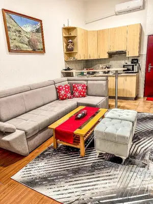 a living room with a couch and a coffee table at Apartman RAJAN Vlašić in Vlasic