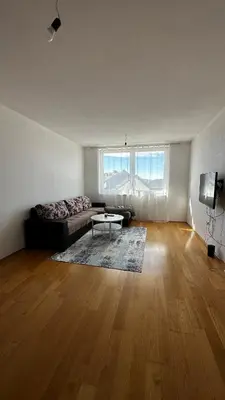 a living room with a couch and a table at Valluna Studio Apartman Kupres in Kupres