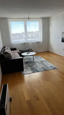 a living room with a couch and a coffee table at Valluna Studio Apartman Kupres in Kupres